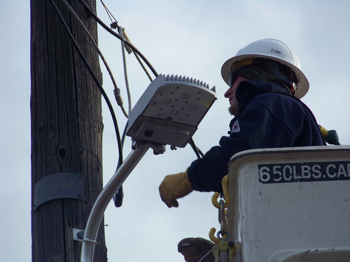 Lincoln County Power District No. 1 lineman, Dell O’Connor installs LED streetlights in Panaca that were funded by the Governor’s Office of Energy.